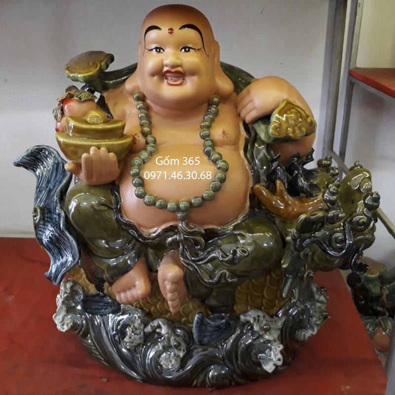 Tượng gốm sứ Bát Tràng - Tượng Phật Di Lặc cưỡi cá chép hóa rồng men xanh